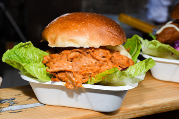 Fresh melting burger ready to eat during fast food festival.