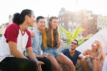 Group of friends having party on a rooftop