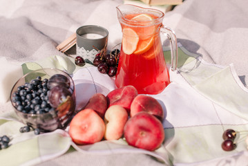fruit on a plaid at a picnic. Summer picnic