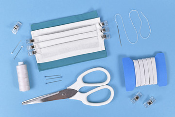 flat lay with homemade face mask for protection against infection with viral disease like COVID-19...