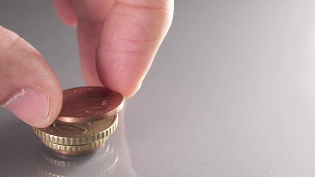 Piling up euro coins with different sizes