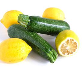 zucchini and lemons on a white background. Vitamins Vegetables.
