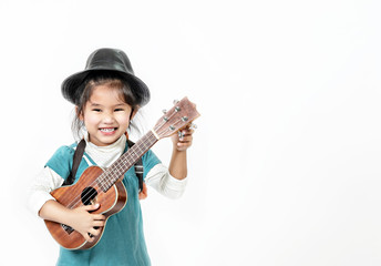 portrait of asian little girl with ukulele over white background