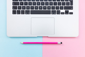 Working from home minimal office laptop computer keyboard pink color background