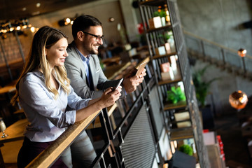 Business colleagues having conversation during coffee break