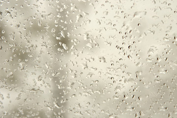 Natural water drops on the glass. gray tones.