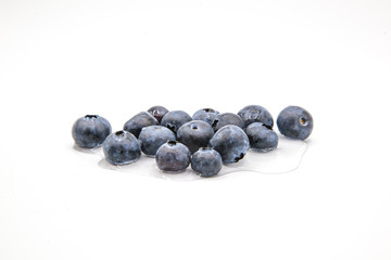 blueberries on white background and water
