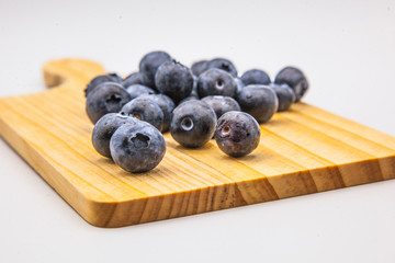 blueberries in a wooden board