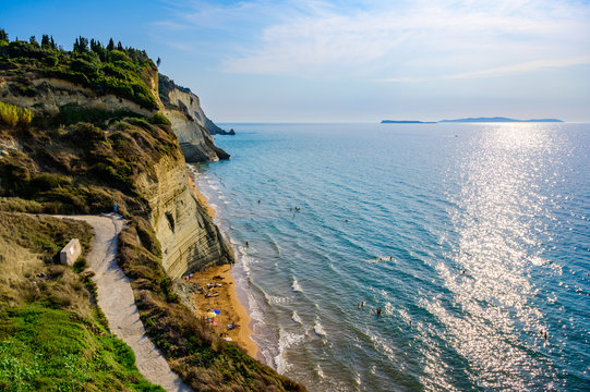 Loggas beach at Peroulades is a paradise beach at  high rocky white cliff and crystal clear azure water in Corfu, close to Cape Drastis, Ionian island, Greece, Europe