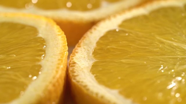 Orange slices closeup, macro food summer background, fruits top view. Rotate