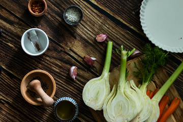 fennel, carrots and spices on wooden board. ingredients fresh vegetables