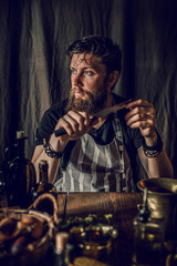 chef man cooking in rustic kitchen