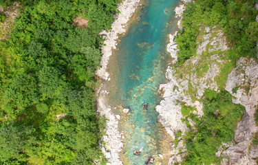 Drone view of turquoise river and forest
