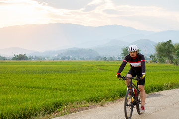 Asian men  ride on a mountain bike. Extreme sport concept