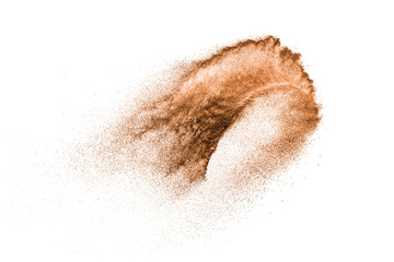 Fototapeta na wymiar Brown powder dust cloud.Brown particles splattered on white background.