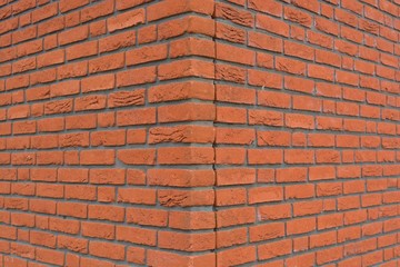 The corner of an orange brick wall texture