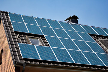 solar panel system installed on roof. Sun power collectors to power a house. Ecological solution of...