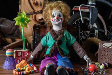 old forgotten toys in the attic including doll hobby horse tricycle and transistor radio