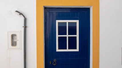 Obraz na płótnie Canvas blue door in the old house