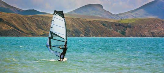 skiing windsurfing in the ocean waves