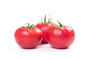 Red fresh tomatoes isolated on white background in close-up