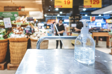 Clear alcohol gel bottles for hand cleaning to prevent the spreading of the corona virus (Covid-19). Place the entrance service for customers before buying in the supermarket.