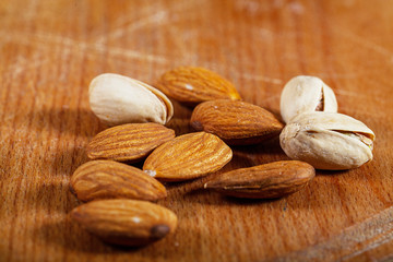 Nuts lie on a wooden kitchen board