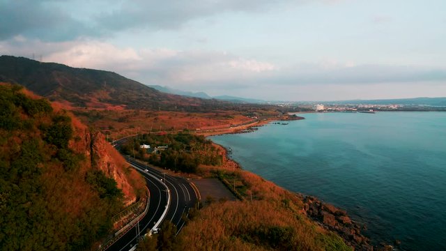 Aerial view of landscape and coastline with road seascape at sunset