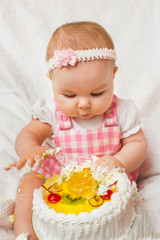 Little girl with a sweet cake