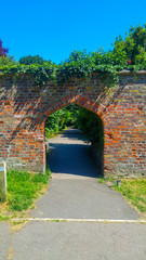 Archway leading to public park. London, UK
