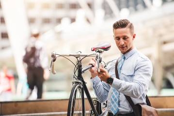 Fototapeta premium Handsome Smile Caucasian Businessman Goto Work with Bicycle in Car Free Day in the City - Urban Lifestyle