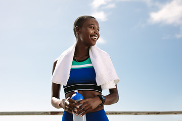 Sportswoman taking break after workout session