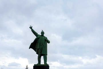 Sculpture of Vladimir Ilyich Lenin in the town square against the blue sky. Ufa city, Russia. Lenin statue.