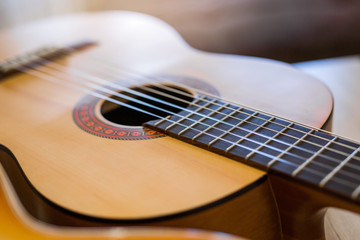beautiful wooden acoustic guitar close-up