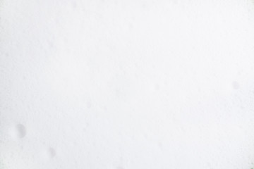 White foam texture. Foam with small bubbles. Spa and skincare and hair care concept. Copy space