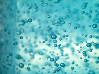 close up blue alcohol sanitizer gel with air bubble inside