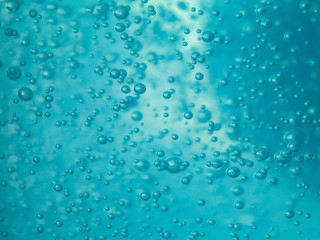 close up blue alcohol sanitizer gel with air bubble inside