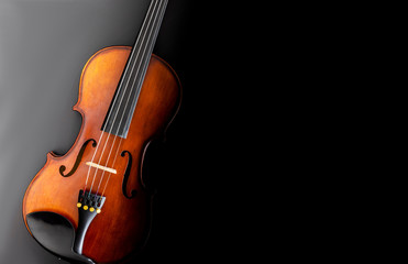 Fototapeta na wymiar classical violin with black background top view wallpaper