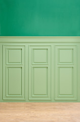 Green classic wall background, blue sofa pillow and working table background.