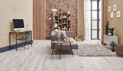 Brown living room interior decoration with wallpaper detail, grey sofa, wooden coffee table and working desk in the living room.