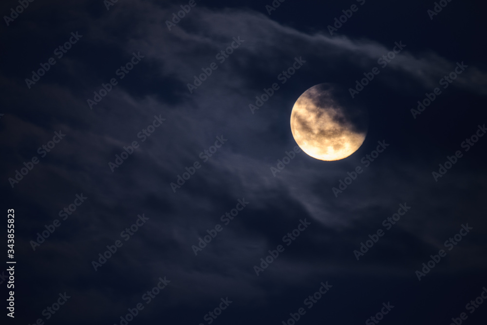Wall mural full moon in the clouds at laconi