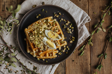 Hot waffles with salad served for breakfast