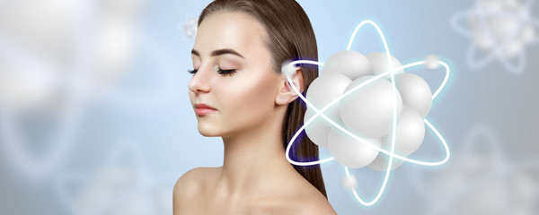 Young woman among molecules atoms over blue background.