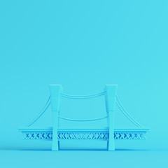 Cartoon styled bridge on bright blue background in pastel colors. Minimalism concept