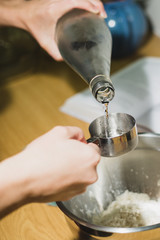 Cool water poured into measuring cup