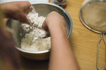 Working butter into flour by hand