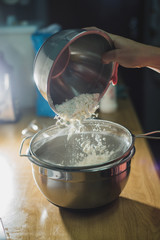 Transfer flour into flour sifter