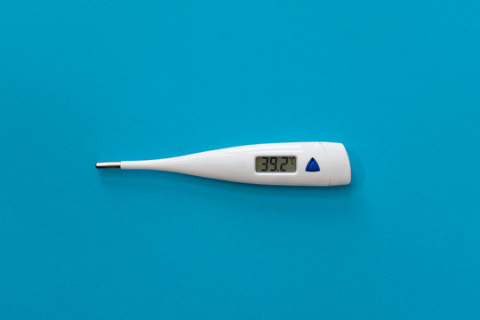 Digital thermometer isolated on blue background with temperature on, copy space - Powered by Adobe