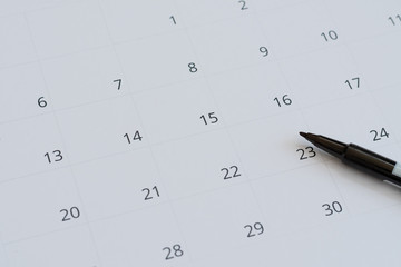 White calendar and black marker, no day selection, date concept