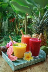 Dragon fruit, papaya and mango smoothies